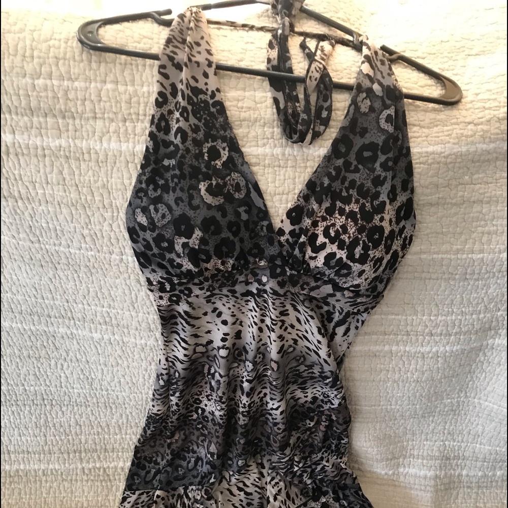 Plunge V neck, breast cups, tie straps, backless, asymmetrical, ruffled hem.